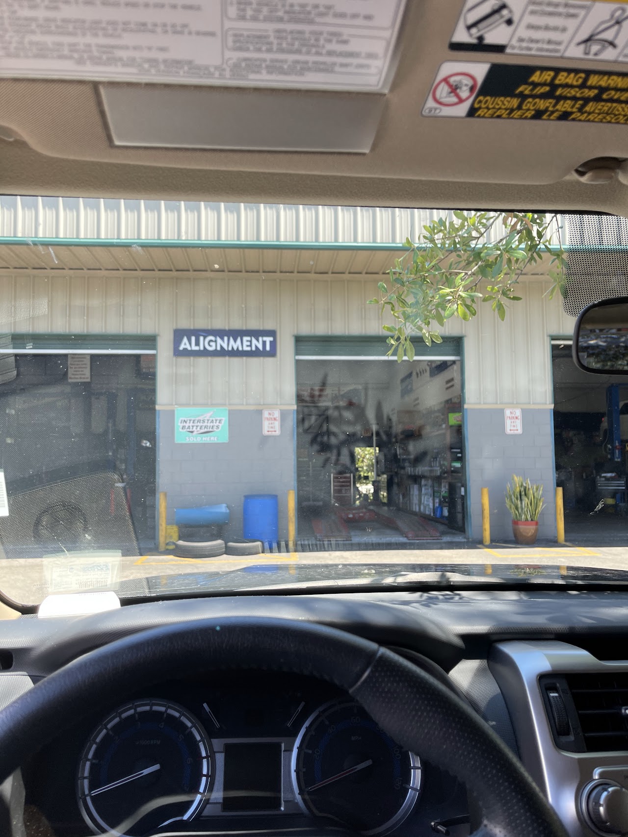 Main auto repair hydraulic lift bay at Fercho Auto Repair in Kissimmee